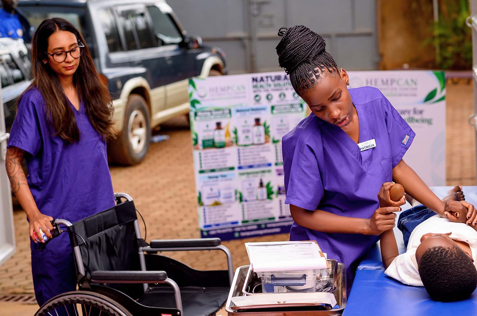 Care professionals supporting a patient during a hands-on treatment session